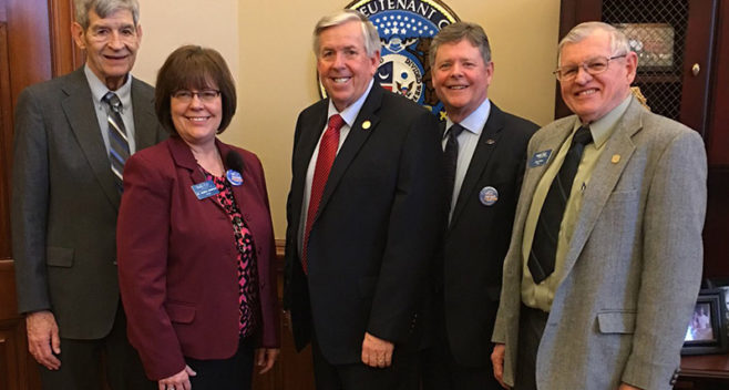 Mike Parson with Dr. Anderson and board members