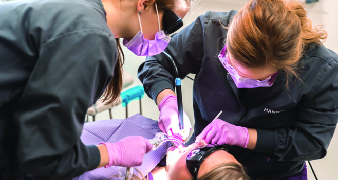 Dental Hygiene students working